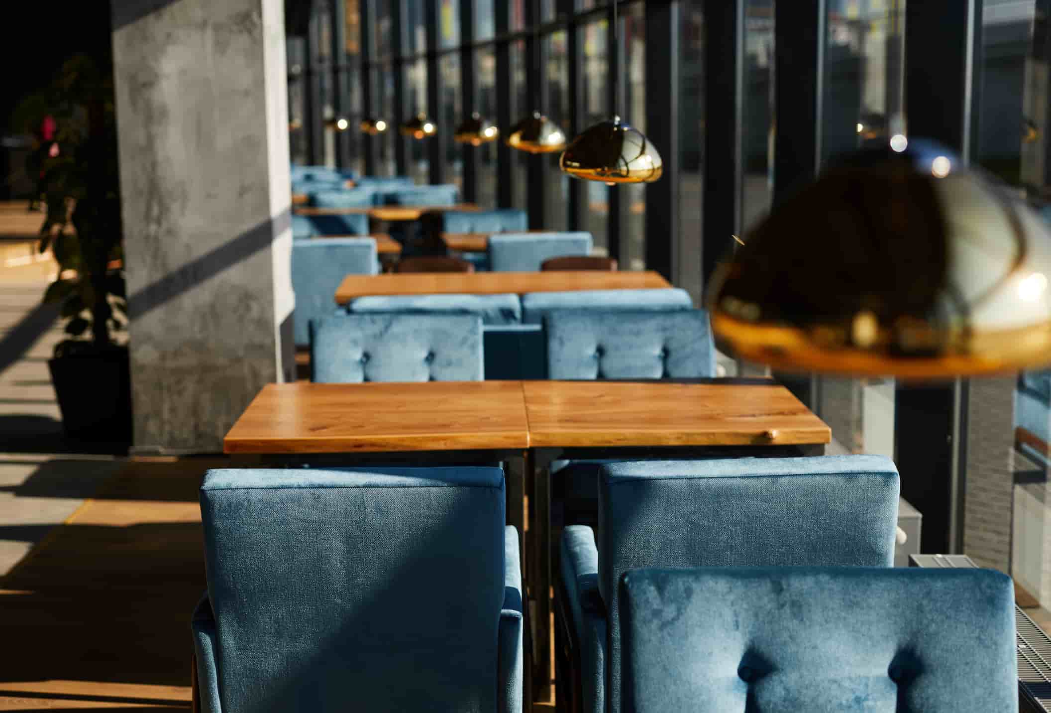 Restaurant table and chair set with upholstered seating, designed for café and commercial dining spaces