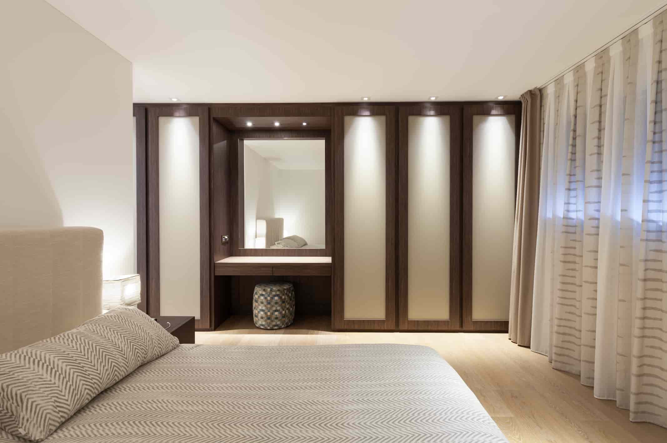 Hotel wardrobe manufacturer in Turkey showcasing custom built-in hotel wardrobe with mirror panels and integrated lighting.