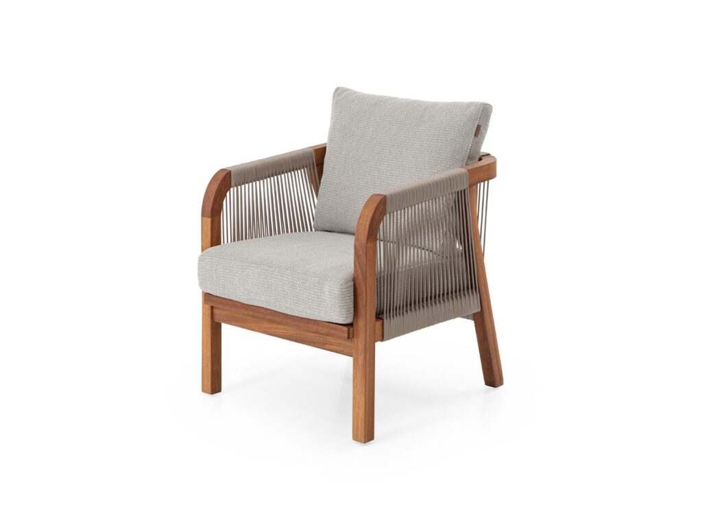 Hotel lounge chair with woven rope sides, wooden frame, and soft upholstered seat cushion.