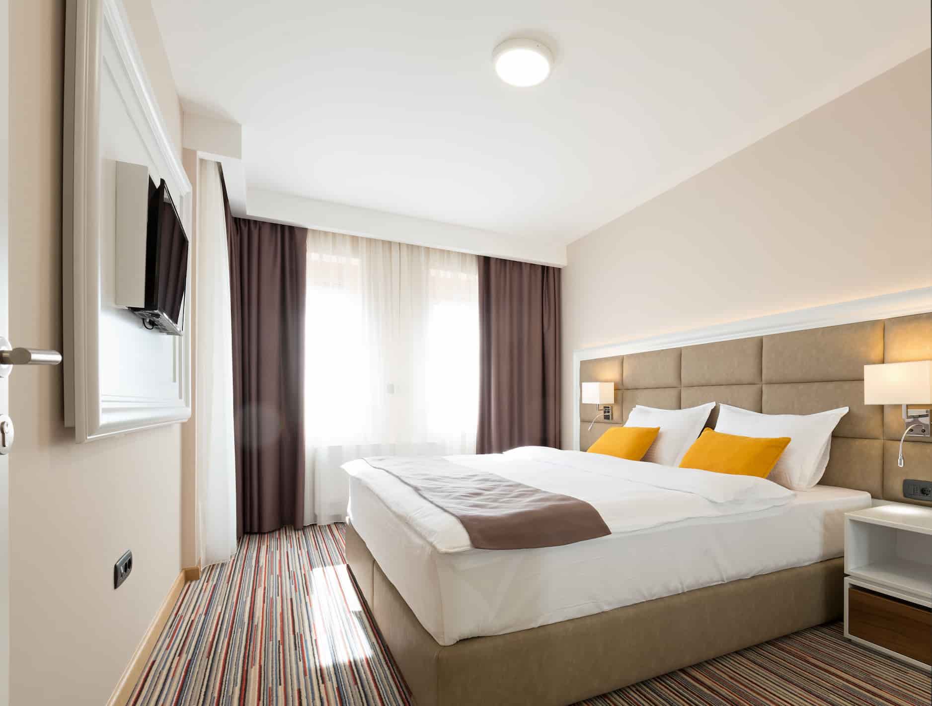 hotel guest room with tv unit