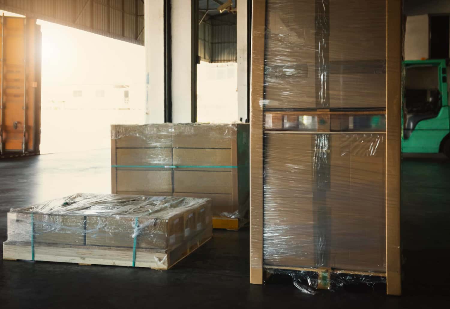 Hotel furniture container loading — packaged casegoods on pallets ready for container loading at Turkish factory