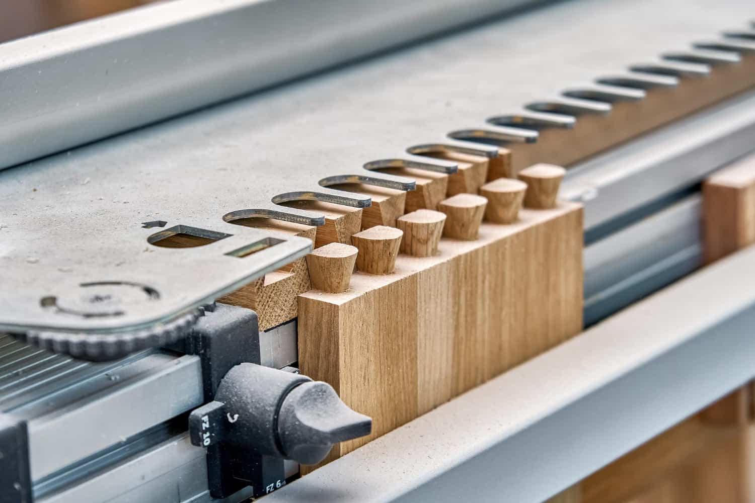 Hotel furniture minimum order quantity — CNC router cutting identical dowel joints in solid wood component on Turkish furniture factory production line