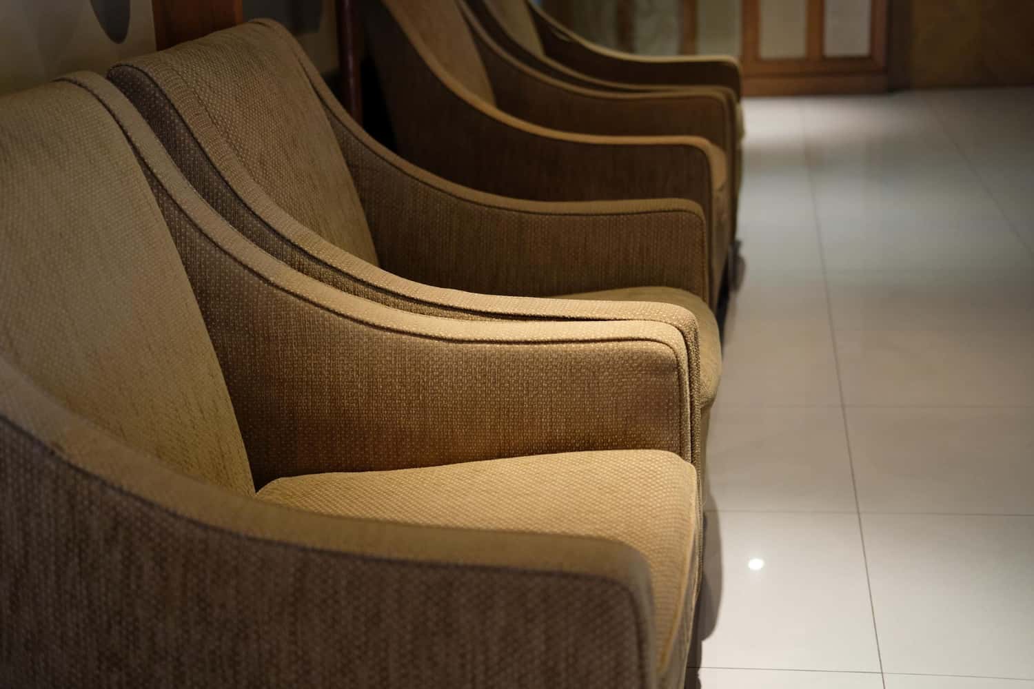 Contract furniture hotel lobby chairs showing consistent upholstery finish and uniform production across multiple units